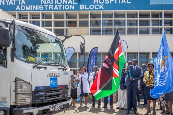 Flags waved as a truck of supplies sets off from Kenyatta National Hospital