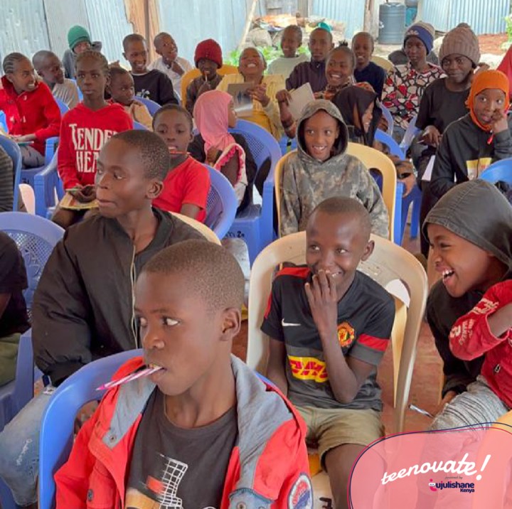 Smiling children seated together during a session